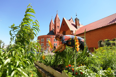 Yelena Kobyak tends to a church garden 