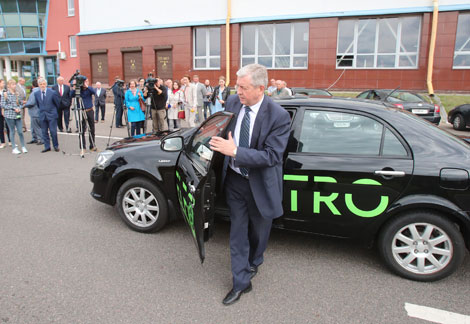 Deputy prime minister of Belarus Vladimir Semashko tests the first Belarusian electric car