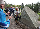 The participant of the Congress Irina Pronina behind a memorial