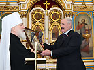 Belarus President Alexander Lukashenko lights Christmas candle in Holy Spirit Cathedral in Minsk