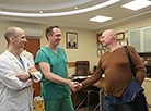 Heart surgeon Vladimir Andrushchuk, patient Leonid Vokhmin and heart surgeon Vitaly Odintsov