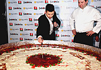 Teo presents a gigantic cheesecake