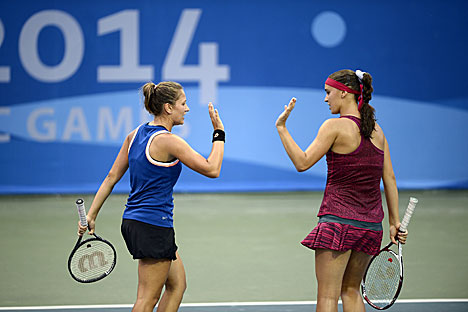 Irina Shimanovich and Ukraine’s Angelina Kalinina in the women’s doubles