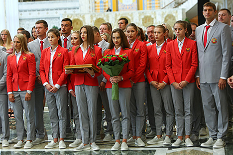 Melitina Staniouta and Yekaterina Galkina, members of Belarus national rhythmic gymnastics team, gave the head of state a commemorative gift