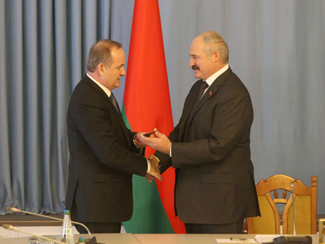 Alexander Lukashenko introducing Chairman of the Board of the National Bank Pavel Kallaur