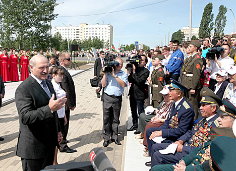 Lukashenko talks with war veterans after the ceremony of laying a time capsule at the Trostenets Memorial