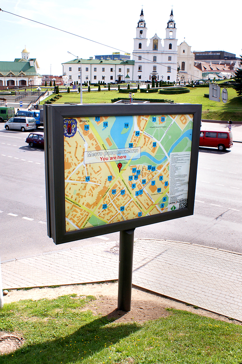 A billboard with the map and QR code in Upper City