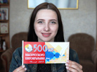 Designer of the Polotsk printing house Milana Talantova shows festive flags