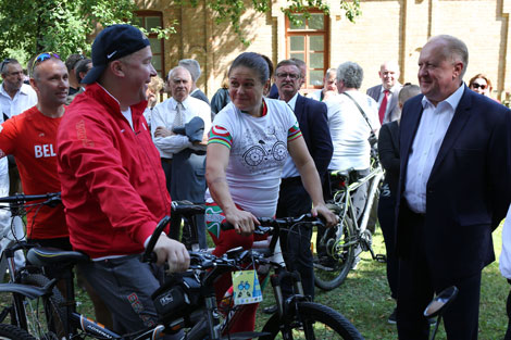 Ministers and diplomats take part in a bike ride across picturesque places of Augustow Canal 