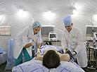 The nurse Anna Zastavenko and the head nurse Olesya Yegorova provide aid in the intensive care department