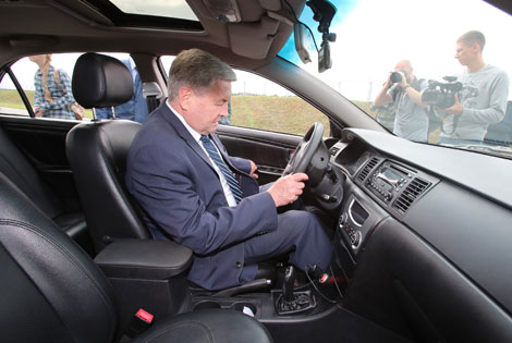 Deputy prime minister tests the first Belarusian electric car