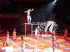 The number Vedy: gymnasts on horizontal bars led by Semyon Maryashin