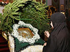 Christmas Eve: nuns and churchgoers decorate the church, Christmas trees and erect the Christmas crib