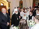 Belarus President Alexander Lukashenko lights a Christmas candle at the Holy Spirit Cathedral in Minsk 