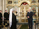 Belarus President Alexander Lukashenko lights a Christmas candle at the Holy Spirit Cathedral in Minsk 
