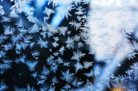 Frost patterns on the window of a Belarus tractor