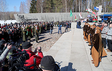 Flower ceremony at the Eternal Flame  in Khatyn Memorial