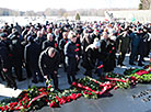 Flower ceremony at the Eternal Flame  in Khatyn Memorial