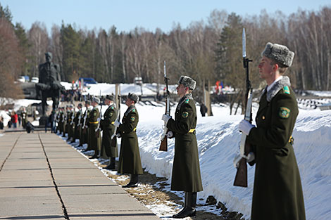 Flower ceremony at the Eternal Flame  in Khatyn Memorial
