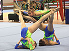 The sports acrobatics tournament Kinder Surprise in progress. Anastasia Kurzova, Tatiana Varivonchik, and Sofia Strugovets