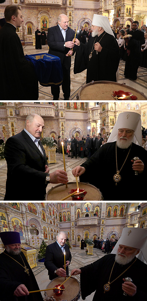 Belarus President Alexander Lukashenko lights a Christmas candle