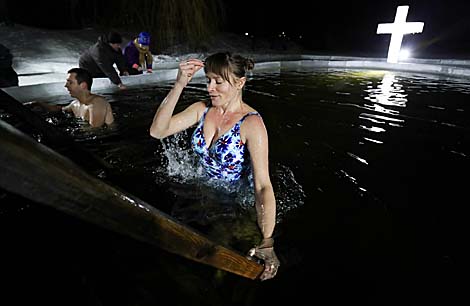 Belarusian dive into ice waters to celebrate Epiphany