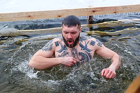 Belarusian dive into ice waters to celebrate Epiphany