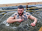 Belarusian dive into ice waters to celebrate Epiphany