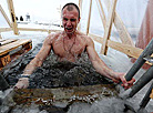 Belarusian dive into ice waters to celebrate Epiphany