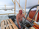 Belarusian dive into ice waters to celebrate Epiphany