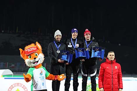 NOC First Vice President Andrei Astashevich presents awards to Men Mass Start medals to Andriy Deryzemlya (Ukraine),  Ole Einar Bjoerndalen (Norway), Sergei Novikov (Belarus)