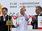 Belarus’ Deputy Prime Minister Igor Petrishenko and Olympic champion Yulia Nestsiarenka