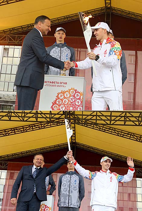 Rio Olympic trampolining champion Uladzislau Hancharou hands the torch over to Vitebsk Mayor Viktor Nikolaikin