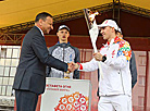 Rio Olympic trampolining champion Uladzislau Hancharou hands the torch over to Vitebsk Mayor Viktor Nikolaikin