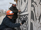 Vladimir Zlenko and Andrei Petkevich are decorating a wall using the sgraffito technique