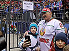 Aleksandr Lukashenko with a young ice hockey player