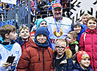 Aleksandr Lukashenko with young ice hockey fans