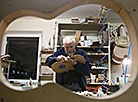 A master from Grodno Andrei Kuban is making a guitar 