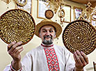 The leader of the straw-weaving hobby group, a member of the Union of Artisans Vasily Simankovich