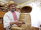 The leader of the straw-weaving hobby group, a member of the Union of Artisans Vasily Simankovich