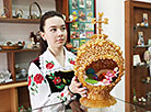 Museum guide Anastasia Bugvina demonstrates an Easter egg made of pasta