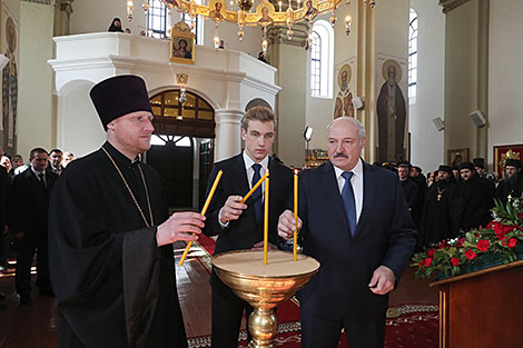 Aleksandr Lukashenko lights an Easter candle in the Holy Annunciation Church in Malye Lyady