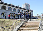 An honor guard unit escorts the capsules to the temple’s entrance