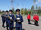 An honor guard unit escorts the capsules to the temple’s entrance