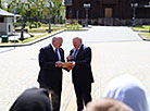 Belarus President Aleksandr Lukashenko and Russian Ambassador to Belarus Dmitry Mezentsev 