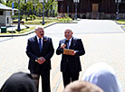 Belarus President Aleksandr Lukashenko and Russian Ambassador to Belarus Dmitry Mezentsev 