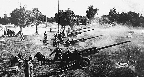 Artillerymen of the 1st Belarusian Front bombard German positions during the battle near the Bug River, Brest Region, July 1944