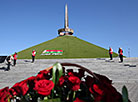 Flowers are laid at the Mound of Glory