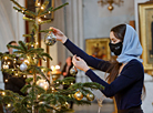 In anticipation of Christmas: Decorating a Christmas tree in the Holy Spirit Cathedral