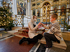 In anticipation of Christmas: Decorating a Christmas tree in the Holy Spirit Cathedral